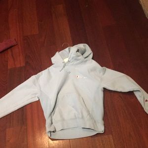 A light blue champion hoodie